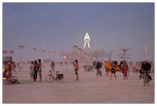 In the middle of the playa, the Man stands 200-feet tall, shining and baking in the desert sun, waiting to burn, perhaps in effigy but at least in fun, at the end of a long week. Many senses, many experiences, lots of input. This was dusk of only day one.